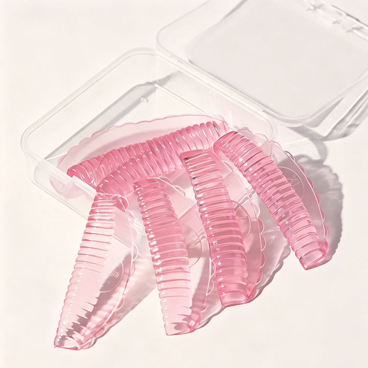 Professional reusable silicone lash lift pads in 4 sizes & 3 colors. Skin-friendly material with groove design for even curls, salon lash lift services.