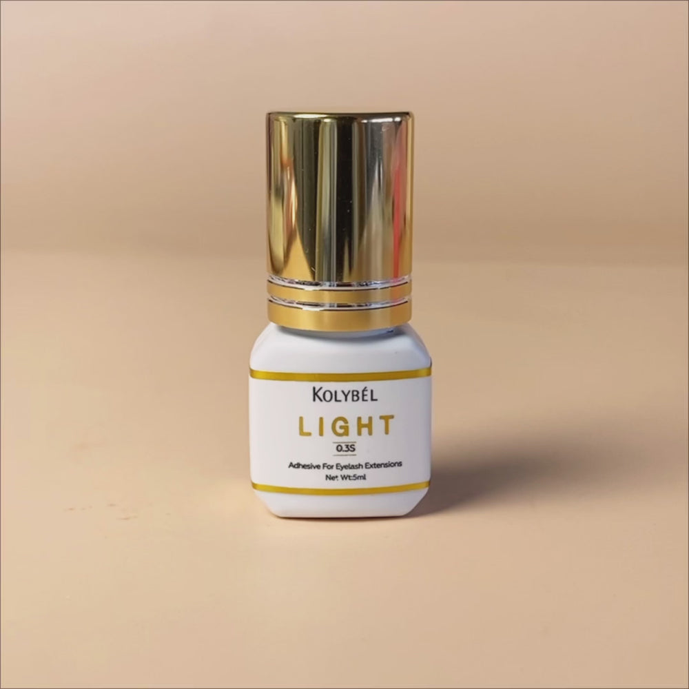 0.3 Second LIGHT Adhesive Eyelash Extension Glue (5ml)-kolybel-This professional eyelash extension adhesive offers ultra-fast 0.3 second drying time and long-lasting retention for experienced lash artists. Its non-toxic formula with glossy black finish is designed for use in controlled salon conditions to create durable, natural-looking lash sets.
